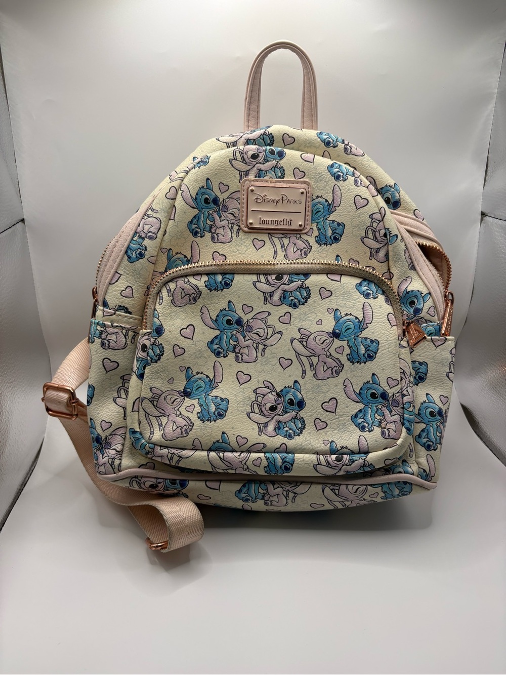 Loungefly Cream Mini Backpack with hearts, angel  & Stitch Print and pink straps